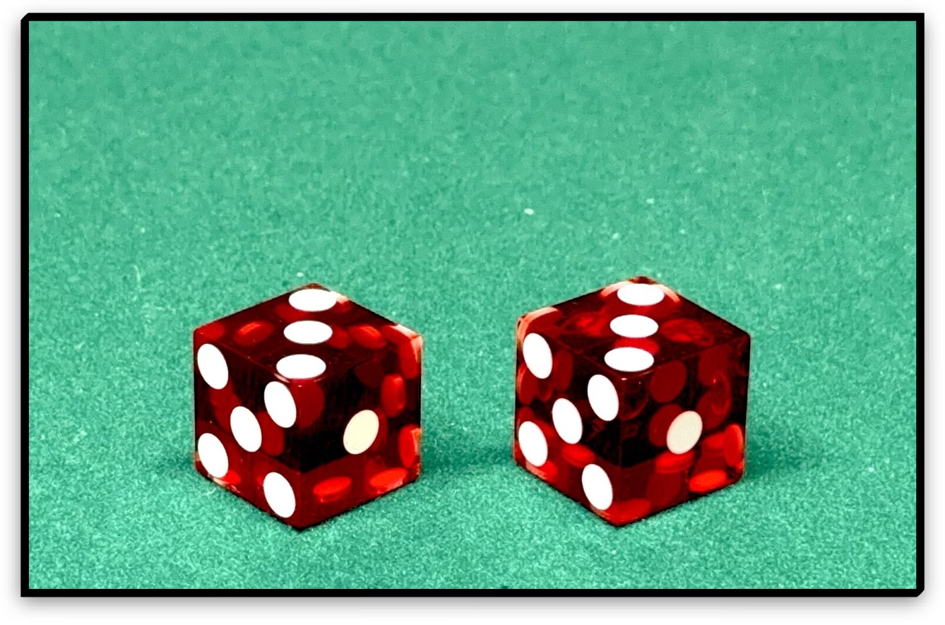 normal dice next to tops